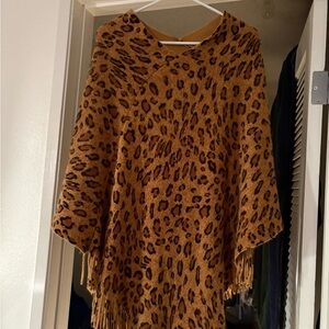 CRAZY TRAIN LONG WARM ANIMAL PRINT PONCHO WITH FRINGE AT BOTTOM